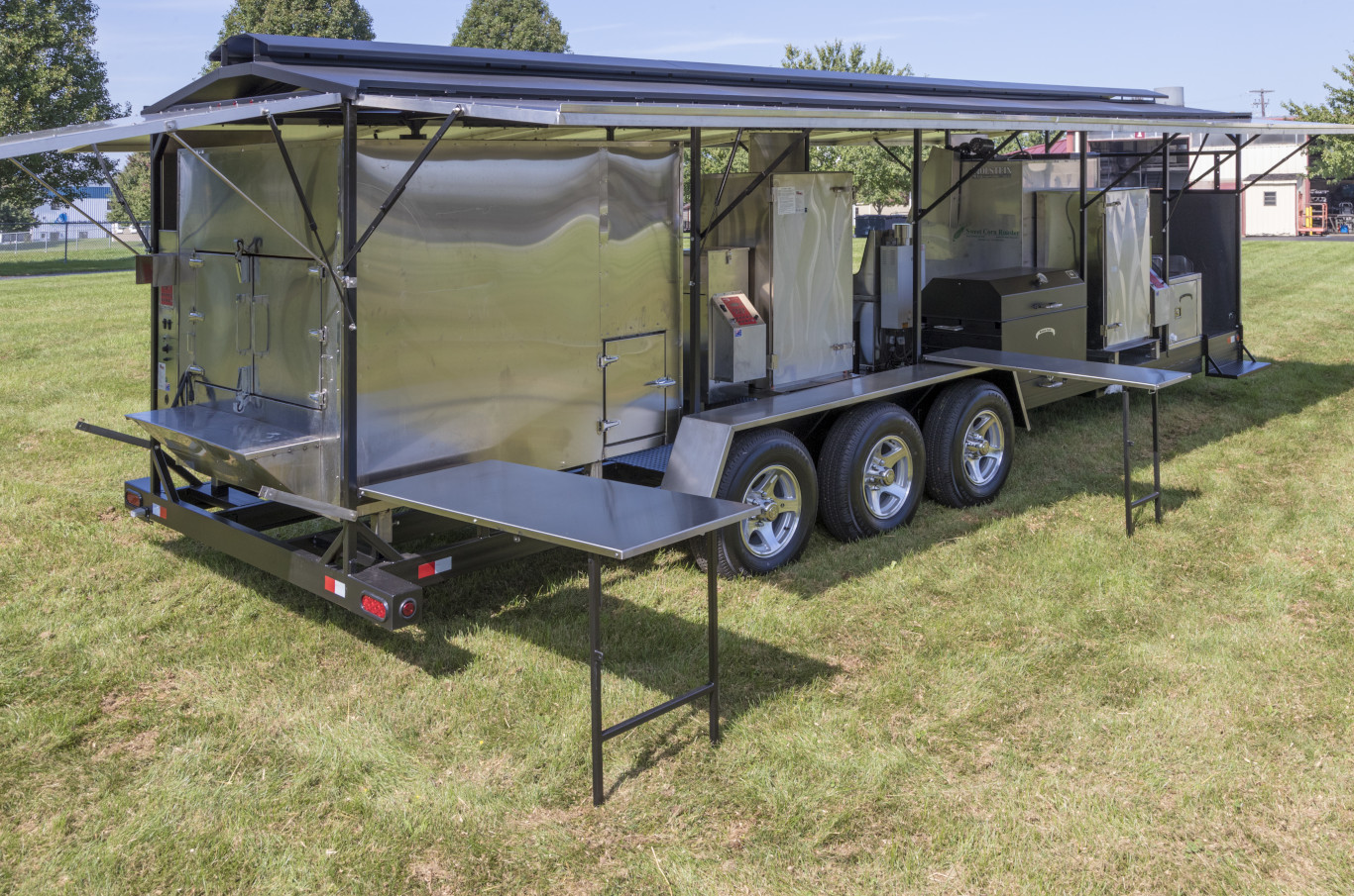 Custom_Trailer-2_13 Custom Barbecue Trailer with roof raised and folding stainless steel tables deployed as an example of custom barbecue trailers
